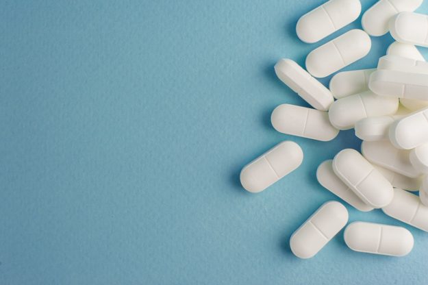 Pills on the floor which may prompt the question what are opiates